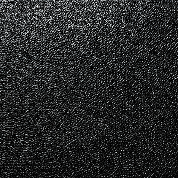 A close-up texture of black full grain leather material filling the entire frame.